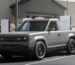 Slate Auto's Blank Slate truck charging at a Tesla Supercharger