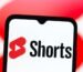 In this photo illustration, the YouTube Shorts logo is seen displayed on a smartphone screen.