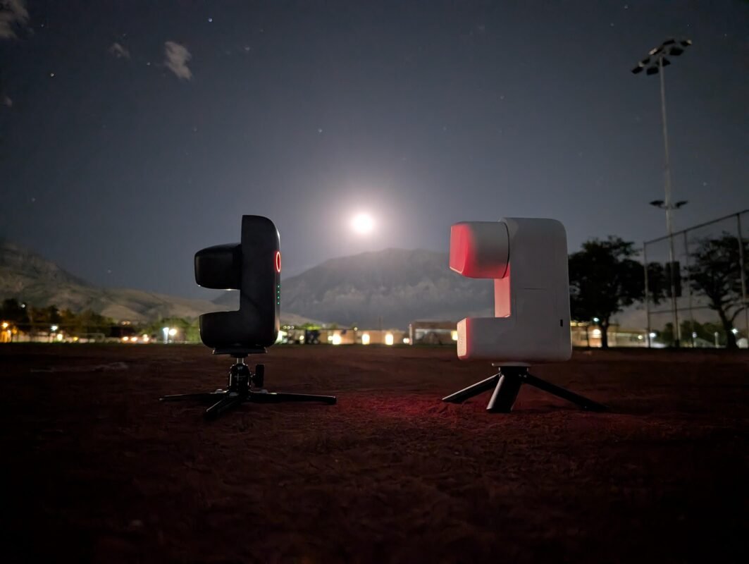 The Dward Mini and Seestar S30 telescopes agains a moon in the sky.