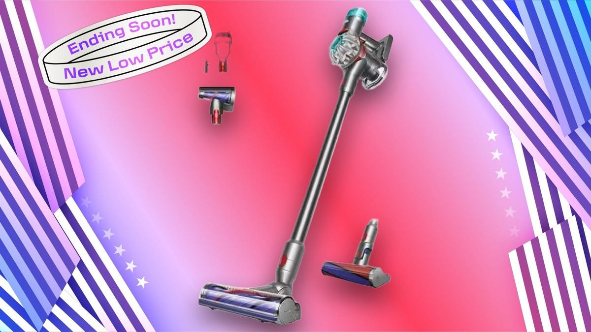 A cordless vacuum with attachments and a sticker on a red, blue and white CNET background.
