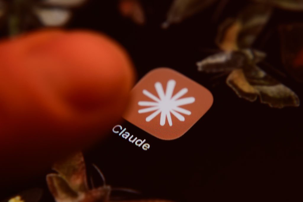 The Claude app icon is displayed on a smartphone screen