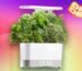 An indoor garden in white color with deal deal sticker on a pink and yellow CNET background.