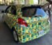 a photo of the toyota yaris covered in a pattern made by Bill Swearingen, as part of a test to see if it can defeat surveillance camera detection.